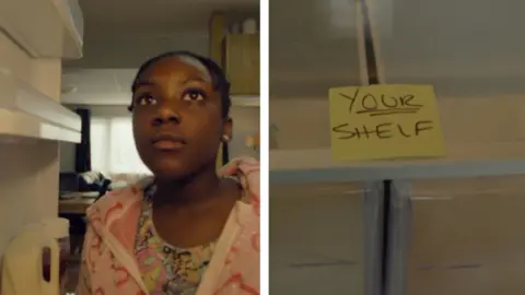 A girl looks into a fridge and sees a note with the words 'Your shelf' written on it.