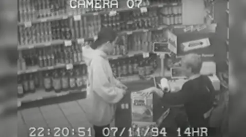 West Yorkshire Police A CCTV image showing Lindsay Rimer buying a box of cornflakes from a shop in 1994