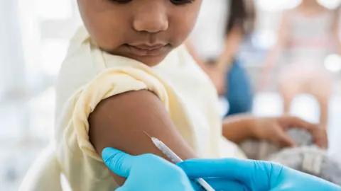 A child receiving an injection