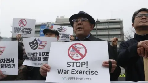 EPA South Korean protesters hold banners reading "Stop War Exercises" during a rally against South Korea and US military forces joint "Key-Resolve / Foal Eagle" military exercises near the US embassy in Seoul, South Korea, 21 March 2018