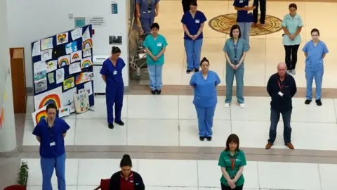 Reuters Staff at Belfast's Mater Hospital observe the minute's silence