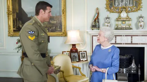 Getty Images Ben Roberts-Smith meeting the late Queen Elizabeth II at Buckingham Palace in 2011