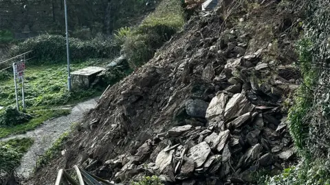 SWCPA Rocks, roots and soil are exposed at the cliff fall in Newquay.