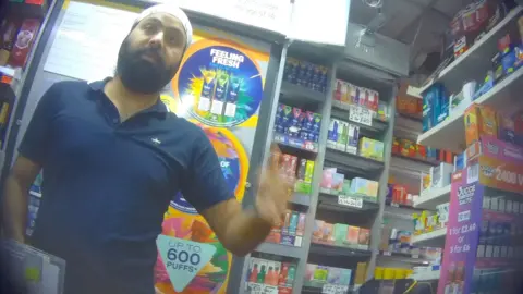 A manager at Midland Supermarket secretly filmed by the BBC inside the store