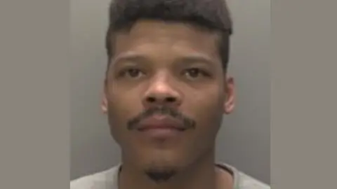 Humberside Police Police mugshot of Tyevon Bean. He has dark hair, a moustache and a goatee beard.