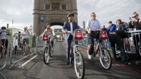 PA Media Sadiq Khan on bike