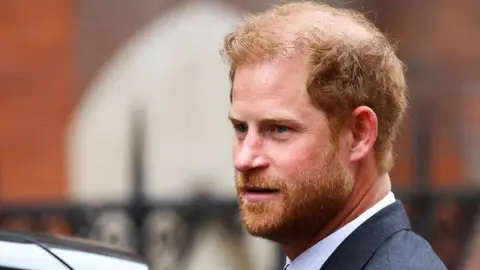 Reuters A close-up short of Prince Harry besides a car