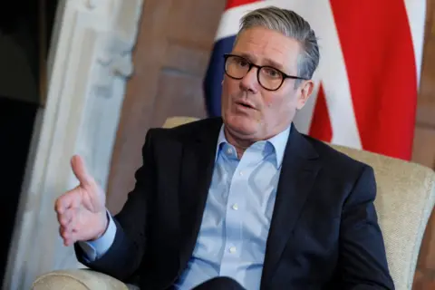 EPA-EFE/REX/Shutterstock Keir Starmer speaks during a meeting with German Chancellor Olaf Scholz (not pictured) at Chequers.