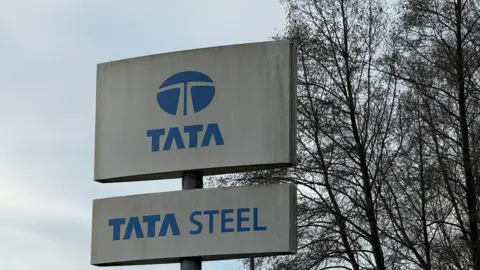 Steve Hubbard/BBC Tata Steel sign, with blue writing on grey steel.