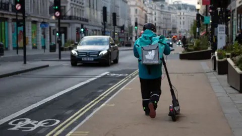 SOPA Images A Deliveroo rider in Regent Street
