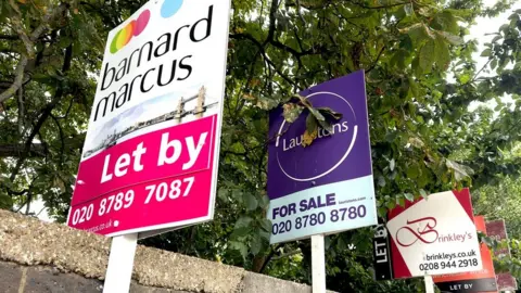 Getty Images House price signs in London