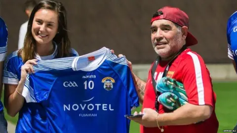 Ammar Ali Maradona is presented with a GAA shirt