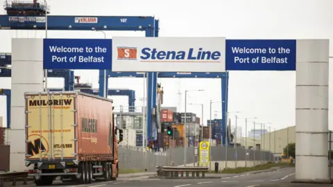 PA Media A lorry and its trailer enter a ferry terminal at Belfast Port