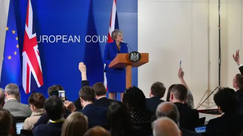 Getty Images British Prime Minister Theresa May speaks at a news conference at the European Union Council headquarters