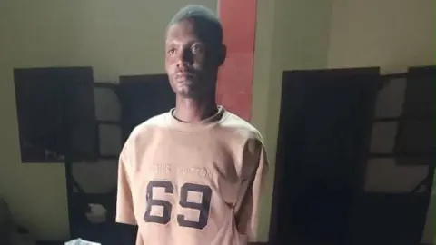Nigerian Army Arrested Nigerian Army Private Mohammed Yusuf wearing a T shirt with 69 written on it
