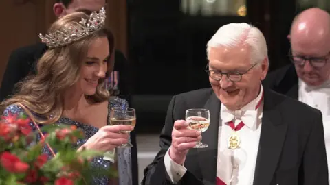 Reuters Catherine shares a toast with President Steinmeier