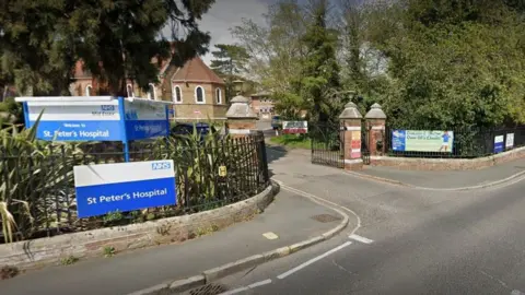 Google Exterior of main gate St Peter's Hospital Maldon showing the hospital sign with building in the background