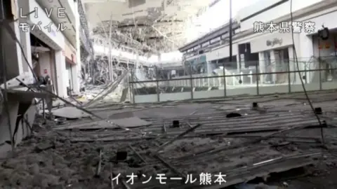  Debris and rubble in the interior of the Aeon Mall shopping centre