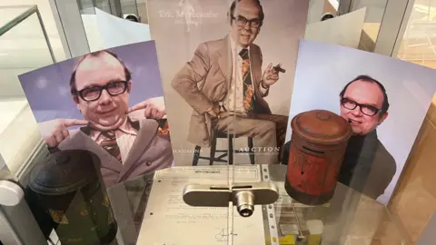 Exhibition case with Eric Morecambe memorabilia