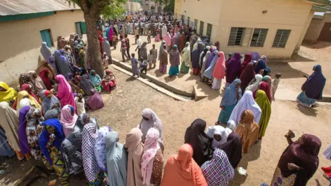 Getty Images People queuing to vote