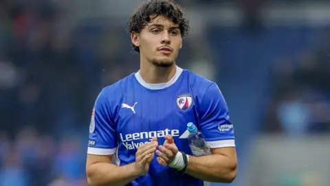 Devan Tanton applauds the Chesterfield fans