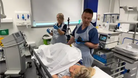 BBC Professor Colin Rees carrying out a colonoscopy