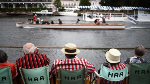 Spectators watch a race on the River Thames at the Henley Royal Regatta in Henley-on-Thames on June 30, 2023