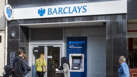 Getty Images Customers outside a Barclays bank