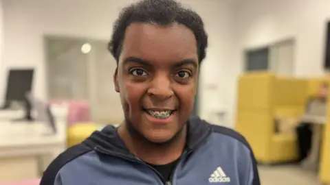 Nicola Haseler/BBC Jayden is smiling