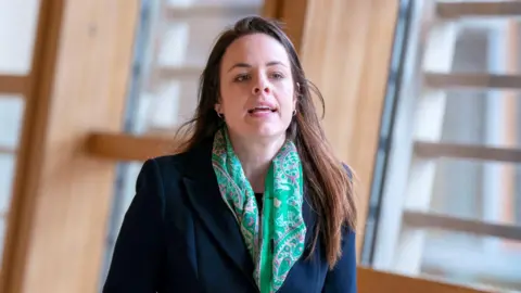 PA Media Kate Forbes walking in the Holyrood lobby