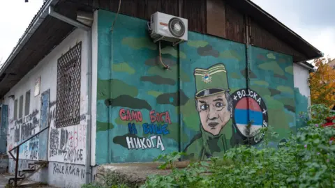 AFP via Getty Images A Sarajevo mural in 2023 in praise of Mladic