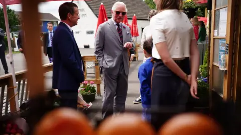 Getty Images Prince Charles met staff from the community shop located outside the Ponthir House Inn