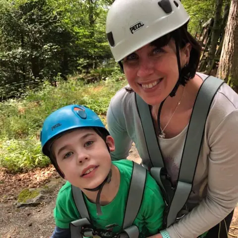 Family handout/PA Media Oliver with his mum, Sarah