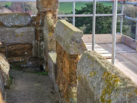 Supplied A closer view of pitted stonework on the church tower with scaffolding visible around the outside