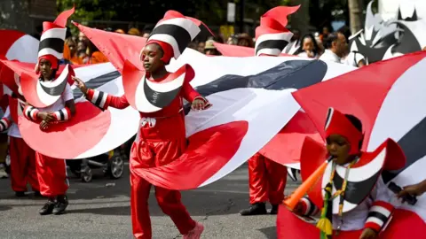 EPA/ANDY RAIN Children at Notting Hill Carnival