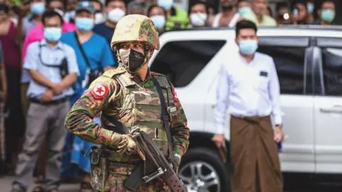 Getty Images Soldier in crowd in Myanmar