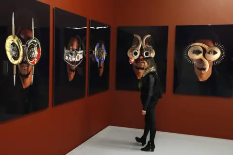 EPA Photographic art by artist Cyrus Kabiru from Kenya at the Zeitz Museum of Contemporary Art Africa.