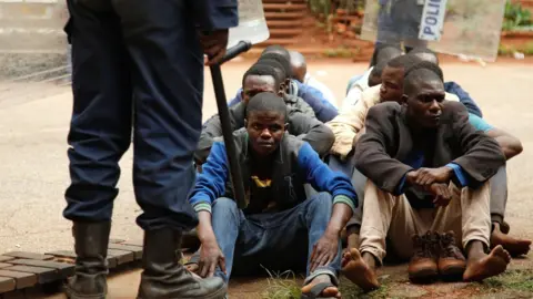 Reuters People arrested during protests wait to appear in the Magistrates court in Harare, Zimbabwe -16 January 2019