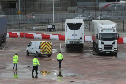 PA Media Lorries at a customs checkpoint at Belfast Port