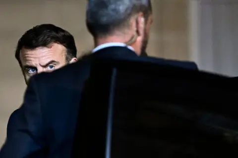 JULIEN DE ROSA / AFP France's President Emmanuel Macron