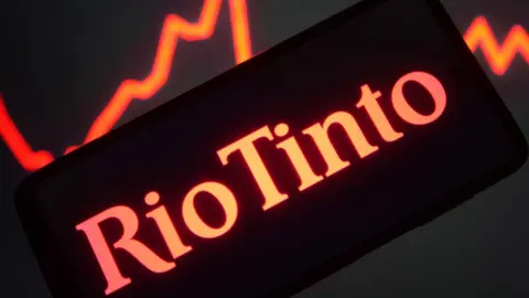 Getty Images The Rio Tinto Group logo is seen on a smartphone screen