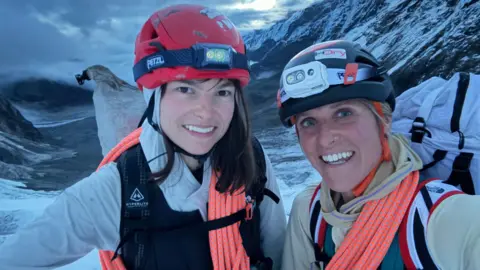 Fay Manners Fay Manners with her climbing spouse  Michelle Dvorak connected  a snowy upland  top