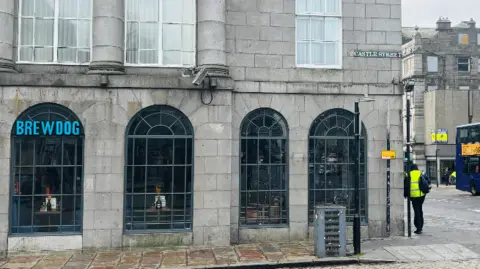 a closed pub on a city centre street