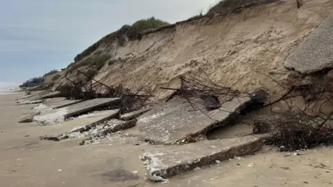 Shaun Whitmore/BBC Coastal erosion damage at Hemsby