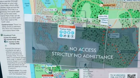 John Fairhall/BBC A map shows areas shaded out with the words "no access, strictly no admittance" written across it. 