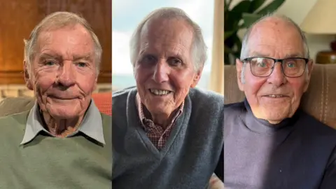 Three head and shoulders images of three older gentlemen. On the left side a man with grey hair, wearing a green jumper with green shirt collar visible smiles at the camera. In the middle a man with receding grey hair wearing a red and white checked shirt with blue v-neck jumper smiles at the camera. On the right a man with thinning grey hair, wearing a blue jumper and black glasses smiles at the camera.