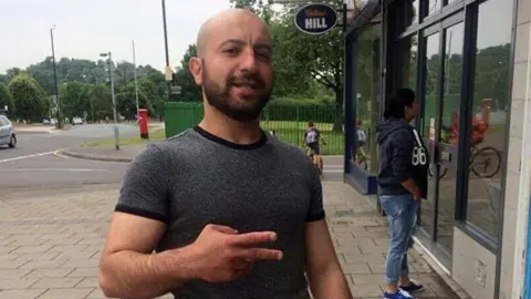 Family Mesut Olgun outside a takeaway in Bristol 