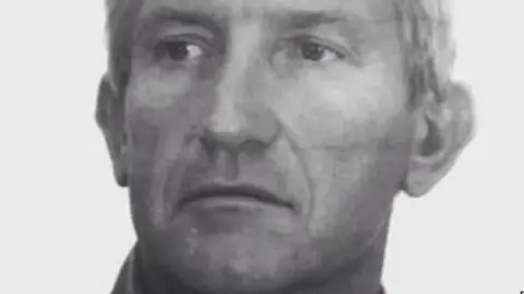 PA Media A black and white image of a man looking to the left of the screen