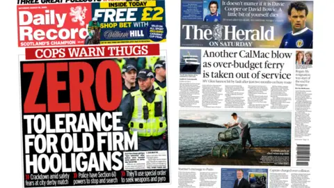 Front pages of the Daily record. which has an image of a police officer next to bold red writing which says 'zero tolerance for old firm hooligans' and 'cops warn thugs' next to the Herald's front page which has an image of a chef holding fishing crates below an article with the headline 'Another CalMac blow as over-budget ferry is taken out of service