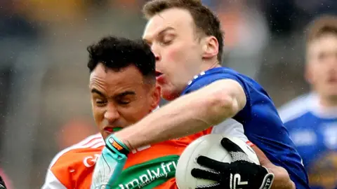 Armagh's Jemar Hall is tackled by Gearoid McKiernan